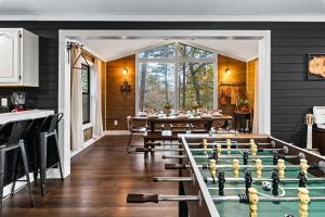 a dining room with a pool table and chessboards at Dolly's Outdoor Oasis in Sevierville