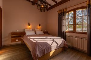 Letto o letti in una camera di L'Interlude