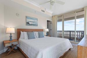 Ένα ή περισσότερα κρεβάτια σε δωμάτιο στο Beach Club Gulf Front 4B Condo - 501 +42 φωτογραφίες