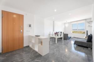 a living room with a kitchen and a dining room at Llanera de Ranes in Llanera de Ranes