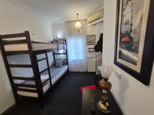 Letto o letti in una camera di Authentic Belgrade Centre Hostel - Only Private Rooms, Paid Parking on-site, Mandatory Reservation