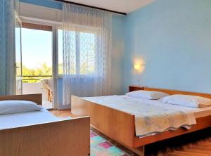 Postel nebo postele na pokoji v ubytování Apartment Jakominic A.