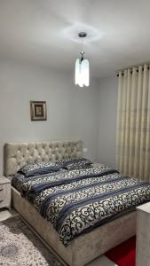 a bedroom with a bed in a room at Sark in Lezhë