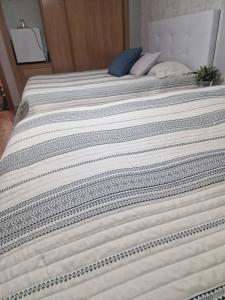 Postel nebo postele na pokoji v ubytování Habitaciones Zoe