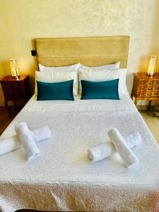a bed with two towels on it with two lamps at Appartement bord de mer Agadir in Agadir