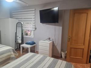 Postel nebo postele na pokoji v ubytování Habitaciones Zoe