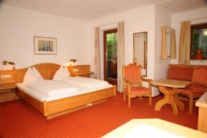 Łóżko lub łóżka w pokoju w obiekcie All Inclusive - Marco Polo Alpina Familien- & Sporthotel