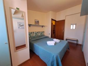 A bed or beds in a room at Mirèa Apartment by Casa in mente