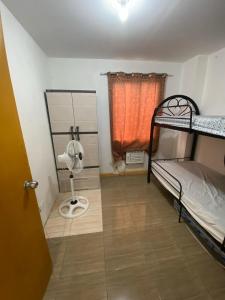 Postel nebo postele na pokoji v ubytování Sunmiles Condominium - 2BR unit M26