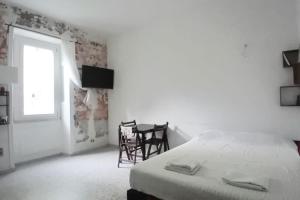 Ένα ή περισσότερα κρεβάτια σε δωμάτιο στο Roma Garbatella - Garby Loft