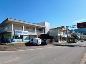 a white van parked in front of a building at Apartamento Termas do Gravatal in Gravatal
