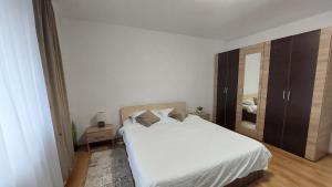 Postel nebo postele na pokoji v ubytování Zamca Studio