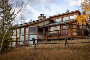 a large wooden house with a large deck at Fairplay Coyote Cabin in Fairplay +55 photos