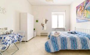 A bed or beds in a room at Il Soffione Home