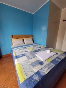 Postel nebo postele na pokoji v ubytování Hospedaje Escorpio