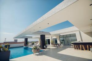 a swimming pool on the roof of a building at Essence 1 BDRM Luxury Apt in Accra