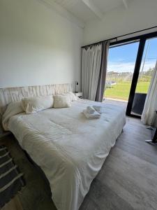 Postel nebo postele na pokoji v ubytování Casa en chapadmalal