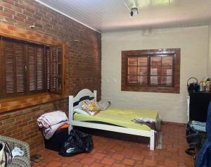 Postel nebo postele na pokoji v ubytování Chácara Sul de MG - Pedralva + 19 fotografií