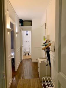 a room with a hallway with a toilet in it at Full house Canal Saint-Martin in Paris