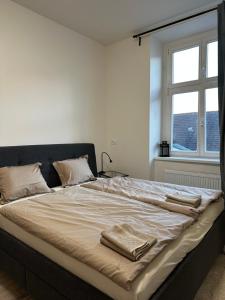 מיטה או מיטות בחדר ב-Apartmán Palackého