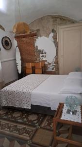 Postel nebo postele na pokoji v ubytování Appartamento in Corte Storica