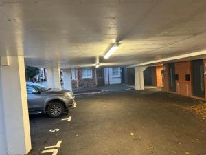 a car parked in an empty parking lot at The Duplex at Sophia Mews with free parking in Cardiff