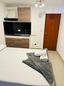 Rúm í herbergi á Hotel Coffee Real Pereira