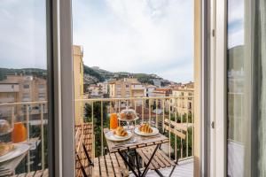 a view from a balcony with a table with food at Casa e Arte in Sorrento