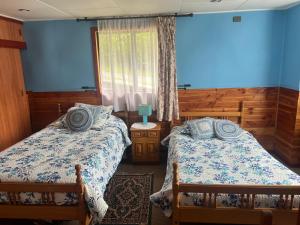 A bed or beds in a room at Cabaña Nalhuitad2