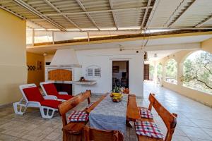 a dining room with a table and some chairs at Holiday Home Gradina, Island of Korčula in Vela Luka +47 photos