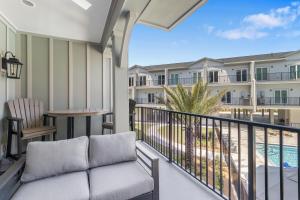 a balcony with a couch and a view of a resort at Gus Getaway by Pristine Properties Vacation Rentals in Highland View
