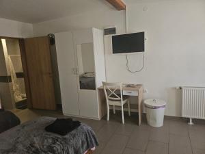 a bedroom with a bed and a basketball hoop on the wall at Pepi Sobe in Čepin