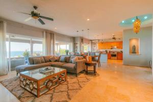 a living room with a couch and a table at Casa de las Olas - Villa Ocean View in San José del Cabo