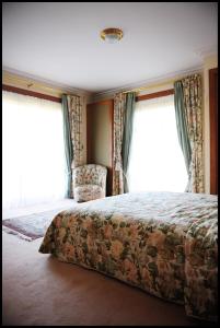 Un pat sau paturi într-o cameră la Ferme Bordbar B&B
