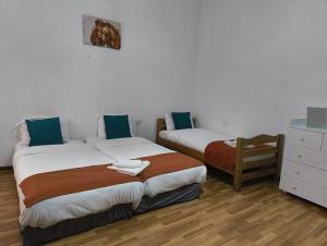Postel nebo postele na pokoji v ubytování GT Boutique Hotel