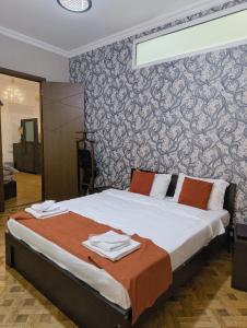 Postel nebo postele na pokoji v ubytování GT Boutique Hotel