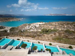 a swimming pool with a view of the ocean at Hotel Milos Sea Resort in Adamantas