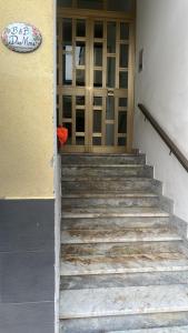 a set of stairs leading to a glass door at B&B DieMme Amalfi Coast in Vietri sul Mare