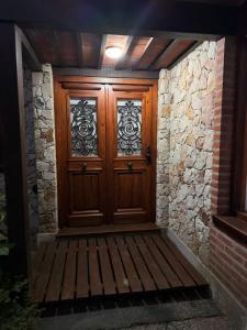 a wooden door with a wooden walkway in front at OKIN 6 La Emperatriz in Costa del Este