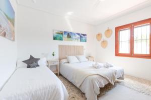 Postel nebo postele na pokoji v ubytování Fidalsa Imperial Malibu + 25 fotografií