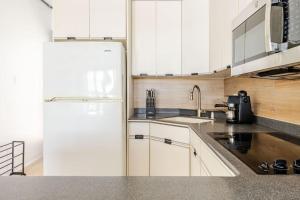 Kuchyň nebo kuchyňský kout v ubytování Beach Apt 302 Guarionex Villa Taina Boqueron Deposit required