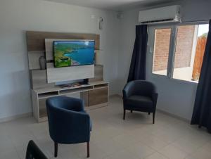 TV/Unterhaltungsangebot in der Unterkunft CASA quinta ""LUZ AZUL"" con pileta, galeria, calefaccion , doble aire frío calor, WIFI