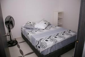 Postel nebo postele na pokoji v ubytování Condominio Tolima