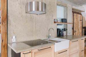 a kitchen with a sink and a counter at Alte Schreinerei in Monschau +7 photos