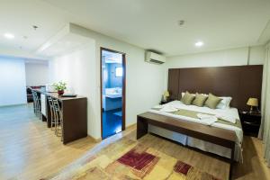 Postel nebo postele na pokoji v ubytování Olavo Bilac Hotel + 37 fotografií