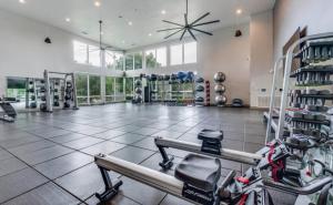 a fitness room with a gym with bikes in it at Luxury Appartement with Everything in Addison