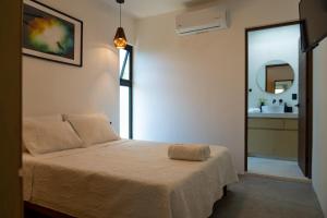 Ένα ή περισσότερα κρεβάτια σε δωμάτιο στο Casa Guapita +64 φωτογραφίες
