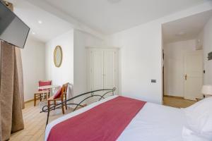 Postel nebo postele na pokoji v ubytování La Cattedrale Rooms