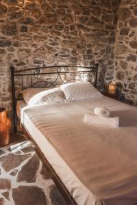 Ένα ή περισσότερα κρεβάτια σε δωμάτιο στο Nephèle - The Embrace of Hospitality