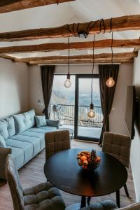 a living room with a table and a couch at Cozy Home - Klet Matija in Novi Marof